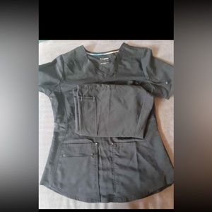 3 sets of scrubs worn once each.